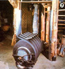 Their Free Flow Stove, with its wrapping of air-convection, heat-exchanger tubes is located in the workshop.